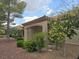 Outdoor patio space with a red tile roof and desert landscaping at 9329 Fresh Spring Dr, Las Vegas, NV 89134