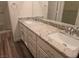 Bathroom with a double granite vanity, large mirror, and a separate room for the toilet and shower at 9329 Fresh Spring Dr, Las Vegas, NV 89134