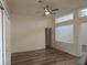 Relaxing bedroom featuring wood floors, neutral colors, and natural light at 9329 Fresh Spring Dr, Las Vegas, NV 89134