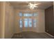 Bright bedroom featuring a ceiling fan, plush carpeting, and a bay window with views of outside at 9329 Fresh Spring Dr, Las Vegas, NV 89134