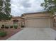 Charming single-story home featuring desert landscaping and a spacious two-car garage at 9329 Fresh Spring Dr, Las Vegas, NV 89134