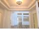 Bright foyer with modern lighting and hardwood floors leading into the home at 9329 Fresh Spring Dr, Las Vegas, NV 89134