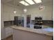 Spacious kitchen features granite counters, stainless steel appliances, and sleek lighting fixtures at 9329 Fresh Spring Dr, Las Vegas, NV 89134