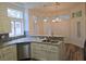 Bright kitchen featuring granite countertops, stainless steel appliances, and ample natural light from surrounding windows at 9329 Fresh Spring Dr, Las Vegas, NV 89134