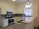 Modern kitchen with stainless steel appliances and granite countertops at 9329 Fresh Spring Dr, Las Vegas, NV 89134
