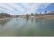 Picturesque pond view with fountains and lush landscaping in the background, enhancing the serene community at 9329 Fresh Spring Dr, Las Vegas, NV 89134