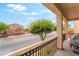 Wide balcony with wrought iron railing, providing outdoor seating with views of the neighborhood at 9704 Morgan Creek Ct, Las Vegas, NV 89141