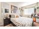 Comfortable bedroom features a queen bed, natural light and modern decor at 9704 Morgan Creek Ct, Las Vegas, NV 89141
