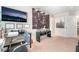 This bedroom features carpeted floors, a television, and unique wall art at 9704 Morgan Creek Ct, Las Vegas, NV 89141
