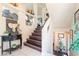 Foyer with a staircase and a side table at 9704 Morgan Creek Ct, Las Vegas, NV 89141