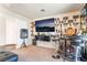 Living room featuring a bar, media center, and carpeted floors at 9704 Morgan Creek Ct, Las Vegas, NV 89141