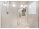 A beautifully tiled walk-in shower features multiple shelves at 9704 Morgan Creek Ct, Las Vegas, NV 89141
