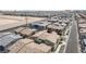 An aerial view of a large planned community with modern homes and desert surroundings at 9929 Bumblebee Hills St, Las Vegas, NV 89141