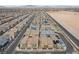 An aerial view captures a dense residential neighborhood with uniform, modern housing designs at 9929 Bumblebee Hills St, Las Vegas, NV 89141