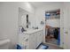 Modern bathroom features a vanity sink and access to the walk-in closet at 9929 Bumblebee Hills St, Las Vegas, NV 89141
