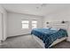 Comfortable bedroom with a wooden headboard and plenty of natural light at 9929 Bumblebee Hills St, Las Vegas, NV 89141