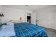 Bright bedroom features a modern bed, dresser and access to walk-in closet at 9929 Bumblebee Hills St, Las Vegas, NV 89141