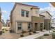 Contemporary two-story home featuring a neutral stucco finish, landscaped front yard, and modern architectural details at 9929 Bumblebee Hills St, Las Vegas, NV 89141