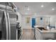 Bright kitchen boasts stainless steel appliances and an open design at 9929 Bumblebee Hills St, Las Vegas, NV 89141