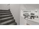 View of the kitchen from staircase, with stainless steel appliances at 9929 Bumblebee Hills St, Las Vegas, NV 89141