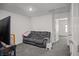 Neutral Gathering room featuring a comfy gray sofa and nice light at 9929 Bumblebee Hills St, Las Vegas, NV 89141