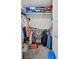 Walk-in closet features built-in shelving units with clothing and shoe boxes at 9929 Bumblebee Hills St, Las Vegas, NV 89141