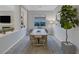 Elegant dining room with modern decor, an area rug, and a view into the adjacent living spaces at , Las Vegas, NV 89148