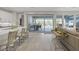 Open-concept living space with a modern kitchen, dining area, and access to an outdoor patio at , Las Vegas, NV 89148