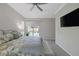 Comfortable main bedroom featuring a large bed, television, and access to the outdoor area through a sliding glass door at , Las Vegas, NV 89148