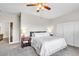 Bedroom featuring ample natural light, neutral colors, ceiling fan, and a comfortable queen-size bed at 10420 Loma Portal Ave, Las Vegas, NV 89166