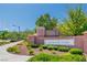 Elegant community entrance sign with well-maintained landscaping, creating a welcoming and attractive first impression at 10420 Loma Portal Ave, Las Vegas, NV 89166