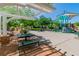 Charming community park featuring a playground, picnic benches, and lush landscaping, perfect for Gathering fun and relaxation at 10420 Loma Portal Ave, Las Vegas, NV 89166