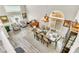 Airy dining room with seating for eight, piano, and an abundance of natural light at 10420 Loma Portal Ave, Las Vegas, NV 89166