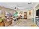 Comfortable living room with natural light, couches, and modern fixtures at 10420 Loma Portal Ave, Las Vegas, NV 89166