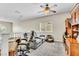 Versatile loft area with comfortable seating, desk, and ample natural light, ideal for a home office or entertainment space at 10420 Loma Portal Ave, Las Vegas, NV 89166