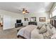 Large bedroom with a ceiling fan and a TV offers a spacious retreat, perfect for unwinding and relaxation at 10420 Loma Portal Ave, Las Vegas, NV 89166