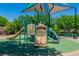 Fun playground with slides and climbing structures, providing a safe and engaging recreational area for children in the community at 10420 Loma Portal Ave, Las Vegas, NV 89166