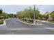 Well-maintained community street lined with mature trees and manicured landscaping at 10420 Loma Portal Ave, Las Vegas, NV 89166