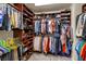 Spacious walk-in closet with custom shelving and organizational system for optimal storage and access at 10420 Loma Portal Ave, Las Vegas, NV 89166