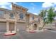 Well-maintained townhome featuring private garages and landscaping, complemented by sidewalks at 10550 W Alexander Rd # 2079, Las Vegas, NV 89129