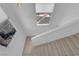 Bright hallway featuring a modern staircase and natural light at 10550 W Alexander Rd # 2079, Las Vegas, NV 89129