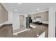 Updated kitchen features granite countertops, tile flooring, stainless steel appliances, and access to laundry room at 10550 W Alexander Rd # 2079, Las Vegas, NV 89129