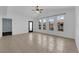 Open concept living area with large windows and tile floors with a neutral paint palette and lots of natural light at 10550 W Alexander Rd # 2079, Las Vegas, NV 89129