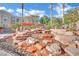 Scenic water feature with rock formations, adding a touch of nature to the community at 10550 W Alexander Rd # 2079, Las Vegas, NV 89129
