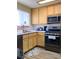 Well-lit kitchen featuring modern stainless steel appliances and light wood cabinets at 1533 Linnbaker Ln # 102, Las Vegas, NV 89110