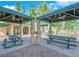 Exterior shot of outdoor grilling and picnic area featuring shade pavilions and desert landscaping at 1533 Linnbaker Ln # 102, Las Vegas, NV 89110