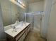 Full bathroom with double sinks and a glass door shower at 1667 Marion Bennet Dr, Las Vegas, NV 89106