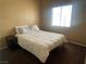 Bedroom with queen size bed and neutral color walls at 1667 Marion Bennet Dr, Las Vegas, NV 89106
