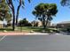 Scenic community park view showing a lush green space with mature trees and walking paths at 1667 Marion Bennet Dr, Las Vegas, NV 89106