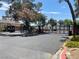 Community entrance gate with black iron details and lush landscaping creating an inviting atmosphere at 1667 Marion Bennet Dr, Las Vegas, NV 89106